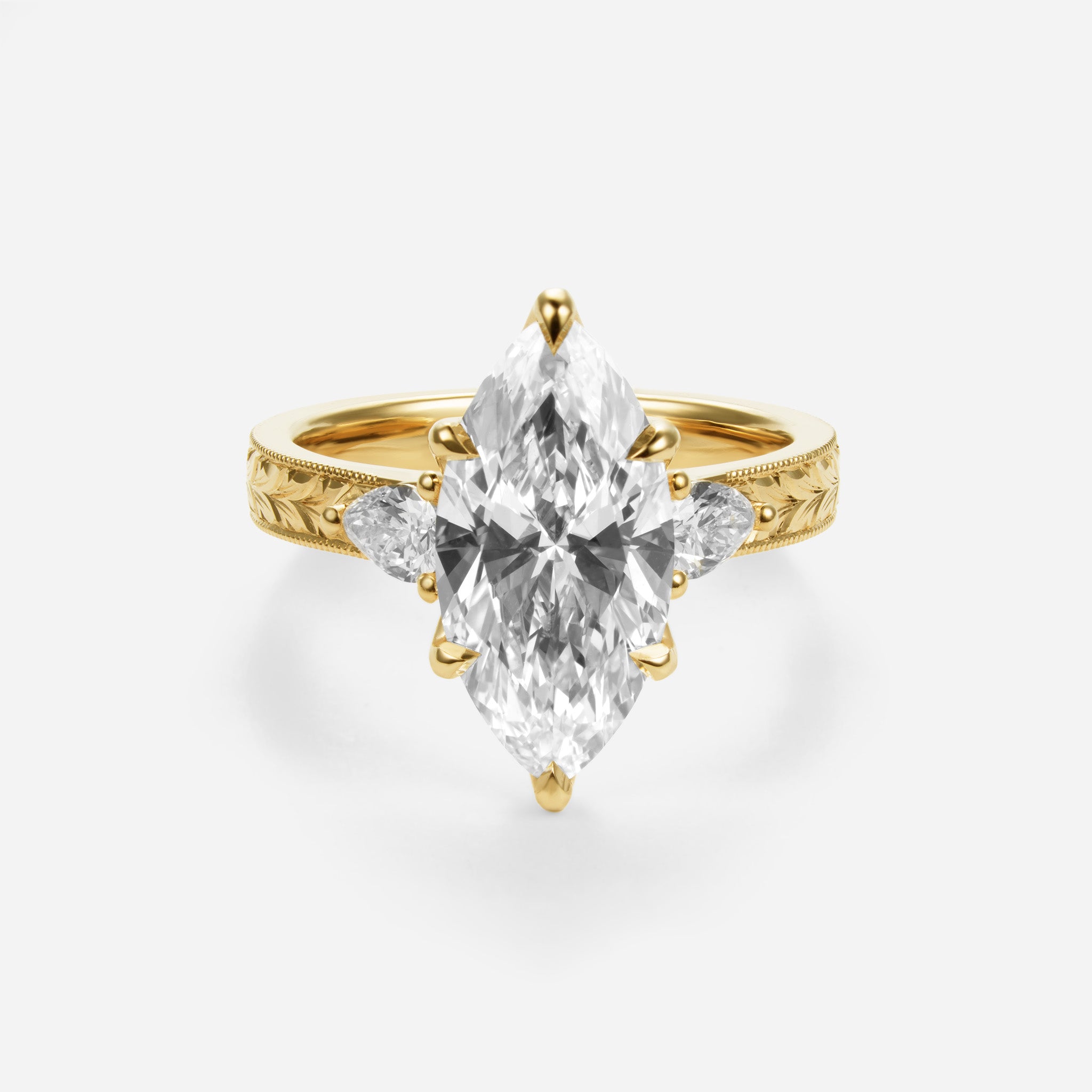 Three Stone Hand Engraved Marquise Engagement Ring